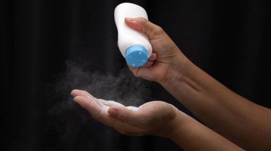 Female hand with talcum powder